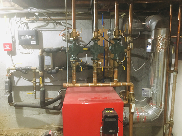 The oil furnace and the plumbing for the wood boiler.