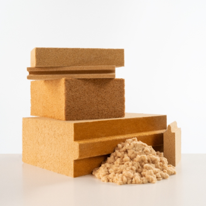 A photo showing wood based insulation in the form of bats, loose fill and timber boards.