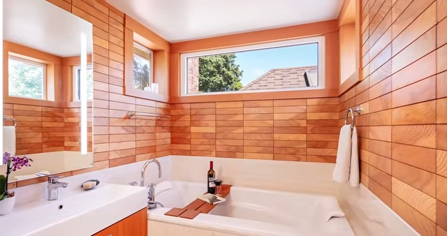A photo of Timber Tiles on the walls of a bathroom.