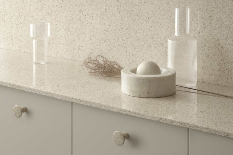 A photo of a wood composite countertop with decorative items on top.